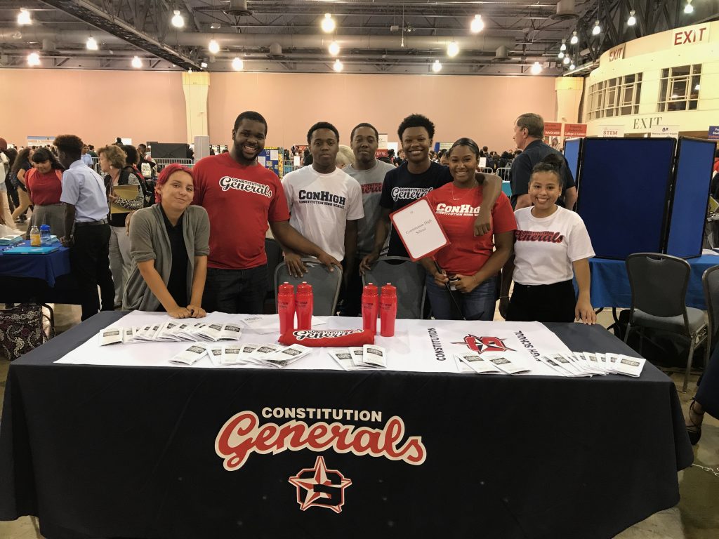Students showcase our school at the High School Fair.